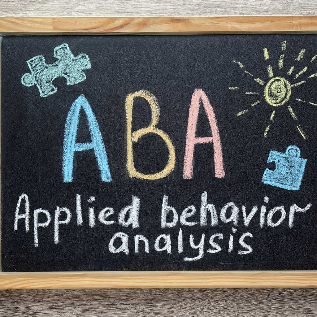Applied behavior analysis chalk sign with puzzle pieces