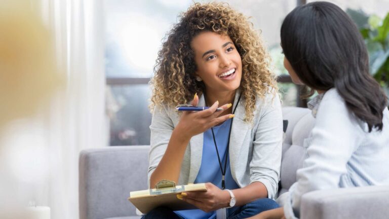 Therapist using the RAADS-R Test to assest autism